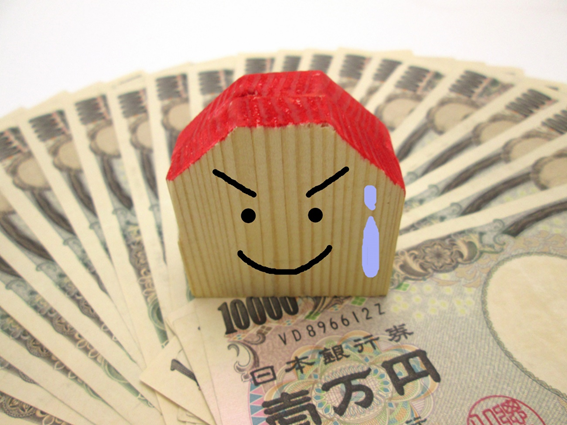 沢山の１万円札、一軒家の模型に書かれた焦った顔